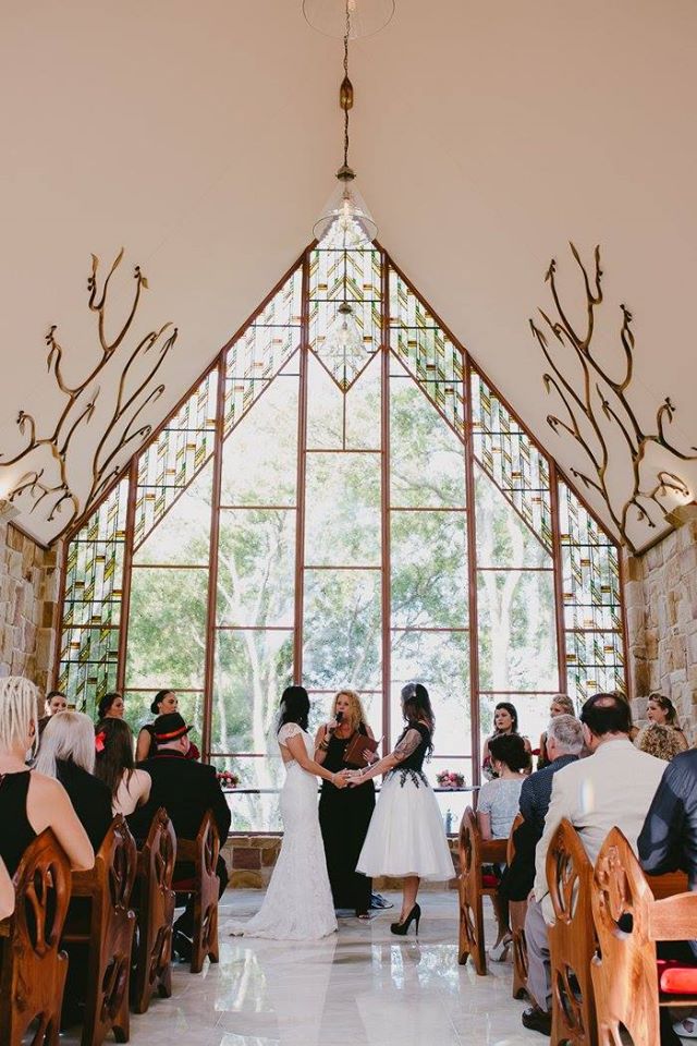 Two brides marrying at The Chapel Montville by Marriage Celebrant Lynette Maguire as their guests look on