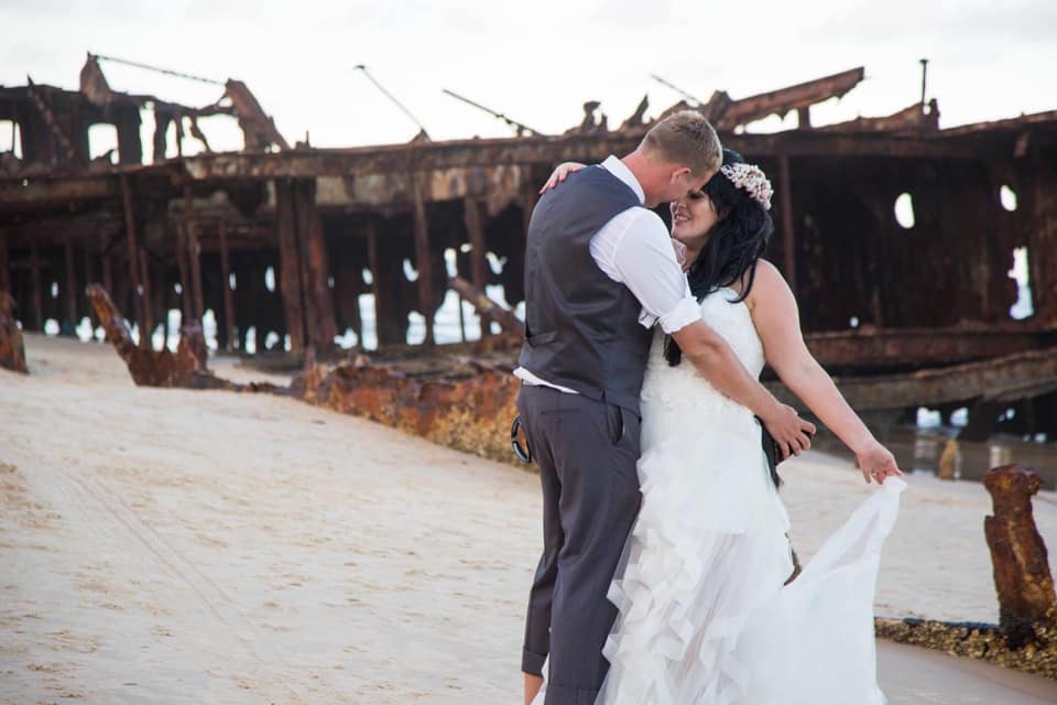 bride and groom dancing next to the Mahino shipwreck on Fraser Island