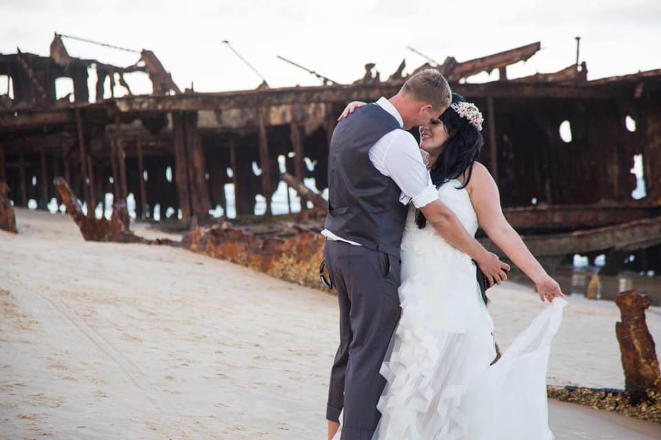Bel and Dan's beautiful wedding - bride and groom dancing next to the Mahino shipwreck on Fraser Island