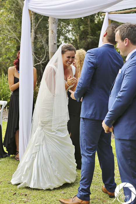 Bride and groom laughing as Lynette Maguire celebrant speaks bride claps