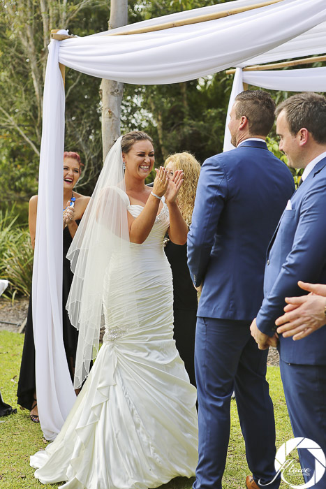 Janell & Patrick Wedding (325) - Bride and groom laughing as Lynette Maguire celebrant speaks bride clapping
