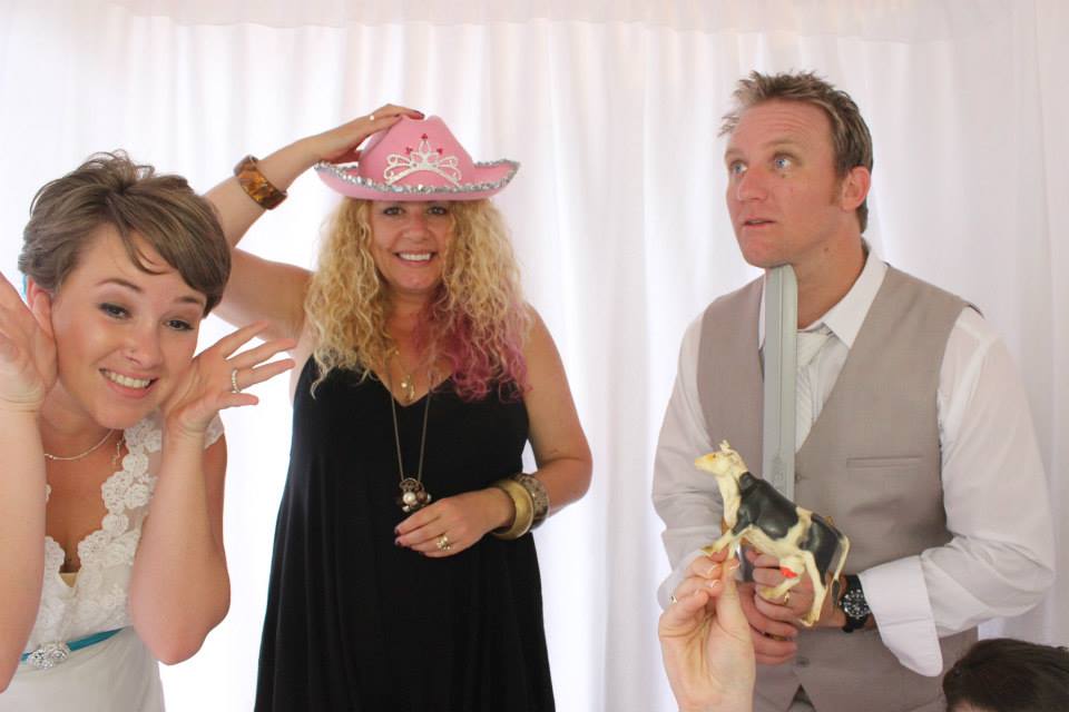 Groom with bridesmaid, and celebrant Lynette Maguire in a photobooth