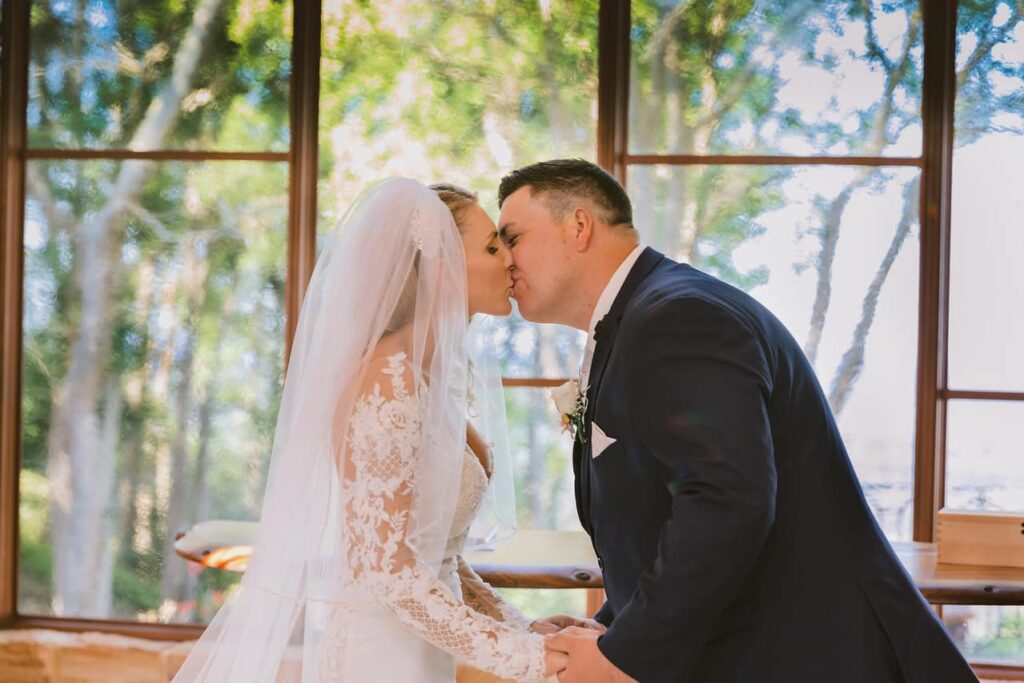 You may kiss your bride ... - Bride and groom kissing at The Chapel Montville