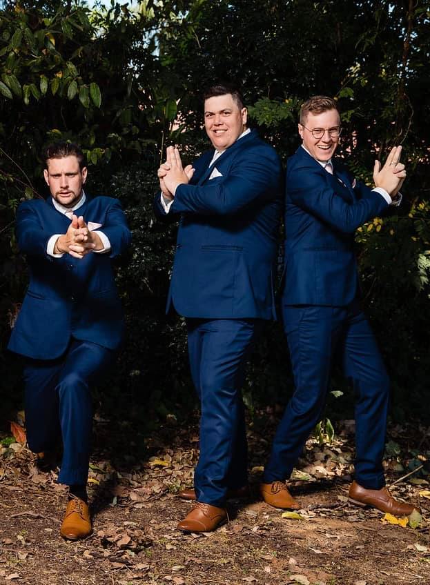 Pre ceremony fun - the groom and his groomsmen Charlie's Angels style