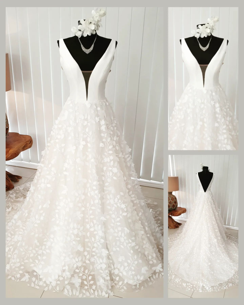 image - Stunning white wedding gown on manikin v-neck top and overlay skirt