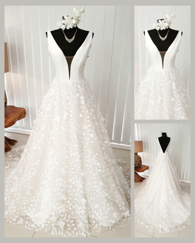 Stunning white wedding gown on manikin v-neck top and overlay skirt