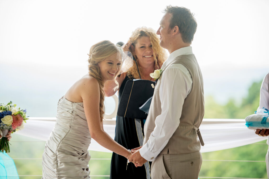 Bride and groom enjoying their wedding with big smiles as Lynette Maguire marriage celebrant officiates